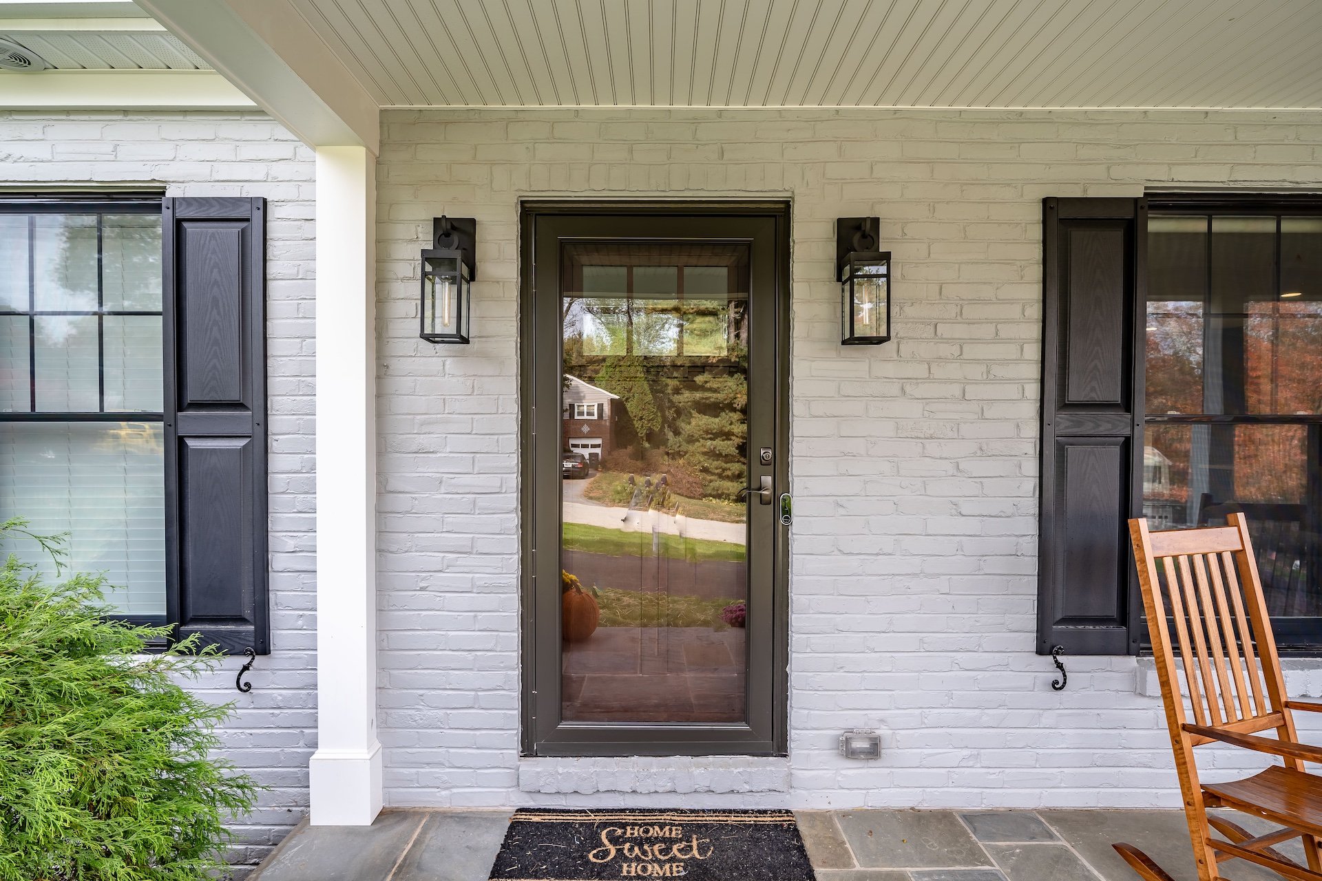 Custom home entry with white brick