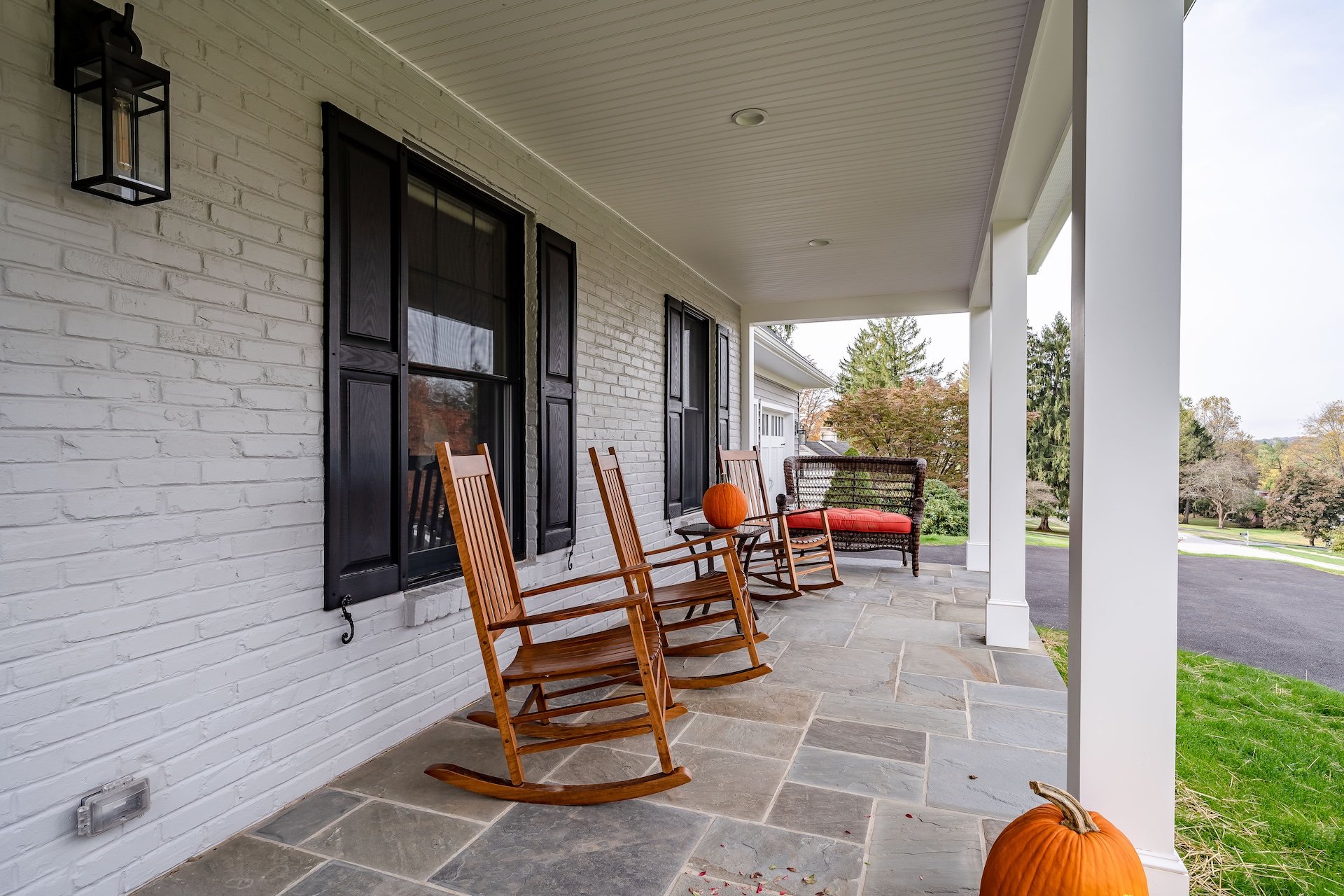 Classic farmhouse porch with rocking chairs