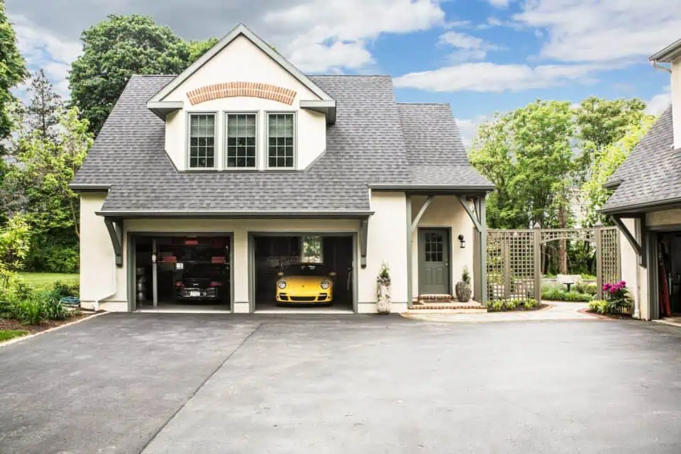 Luxurious two-car garage with yellow Porsche