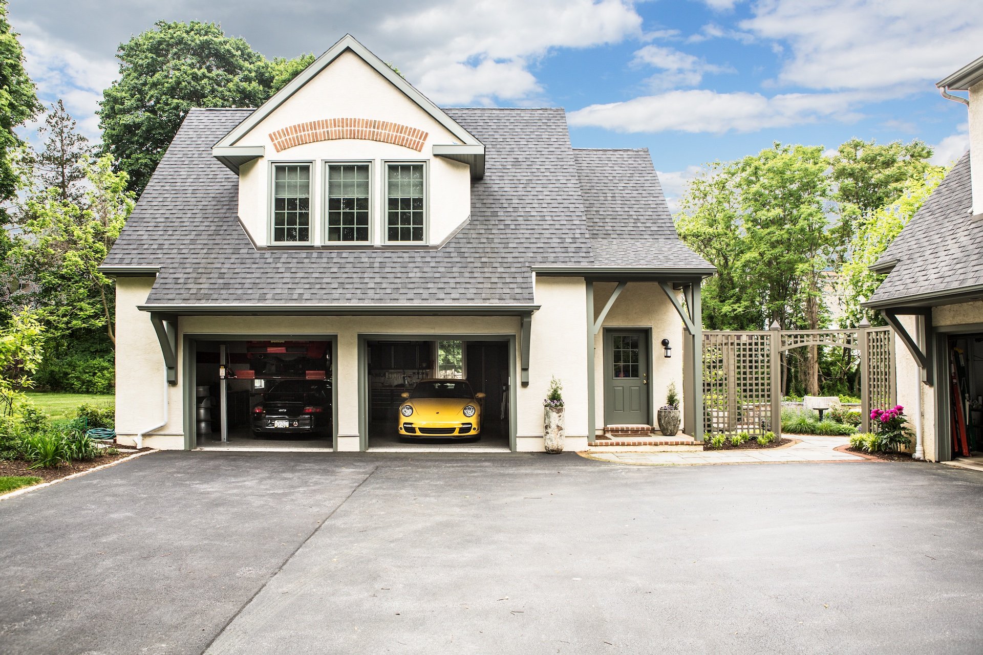 Luxurious two-car garage with yellow Porsche