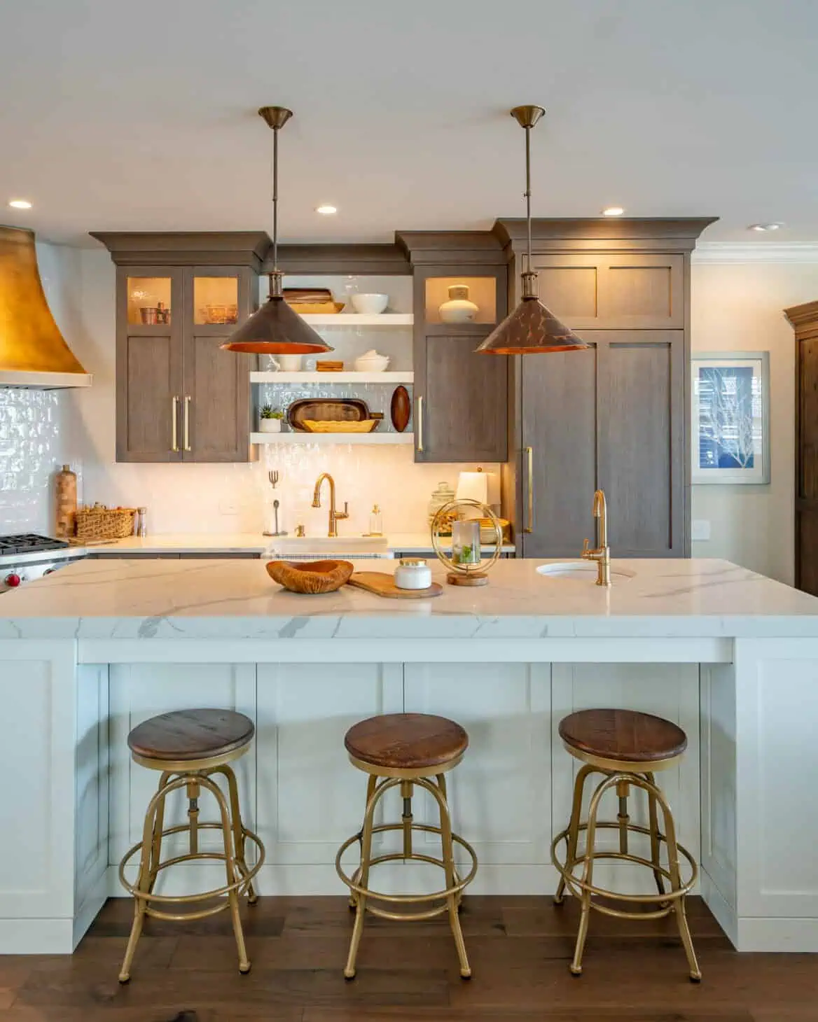 Renovated kitchen in West Chester PA with light blue island and three bar stools
