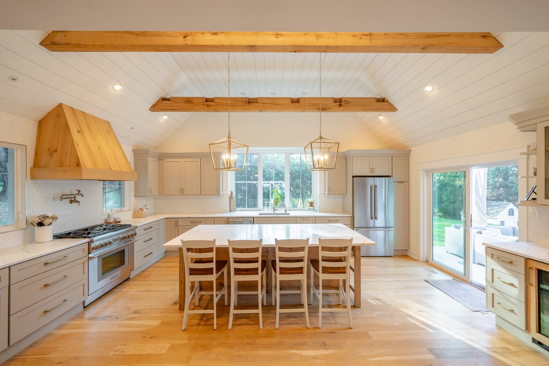 How to Find the Best Builder for Renovations 3 Large kitchen with warm wood accents and center island