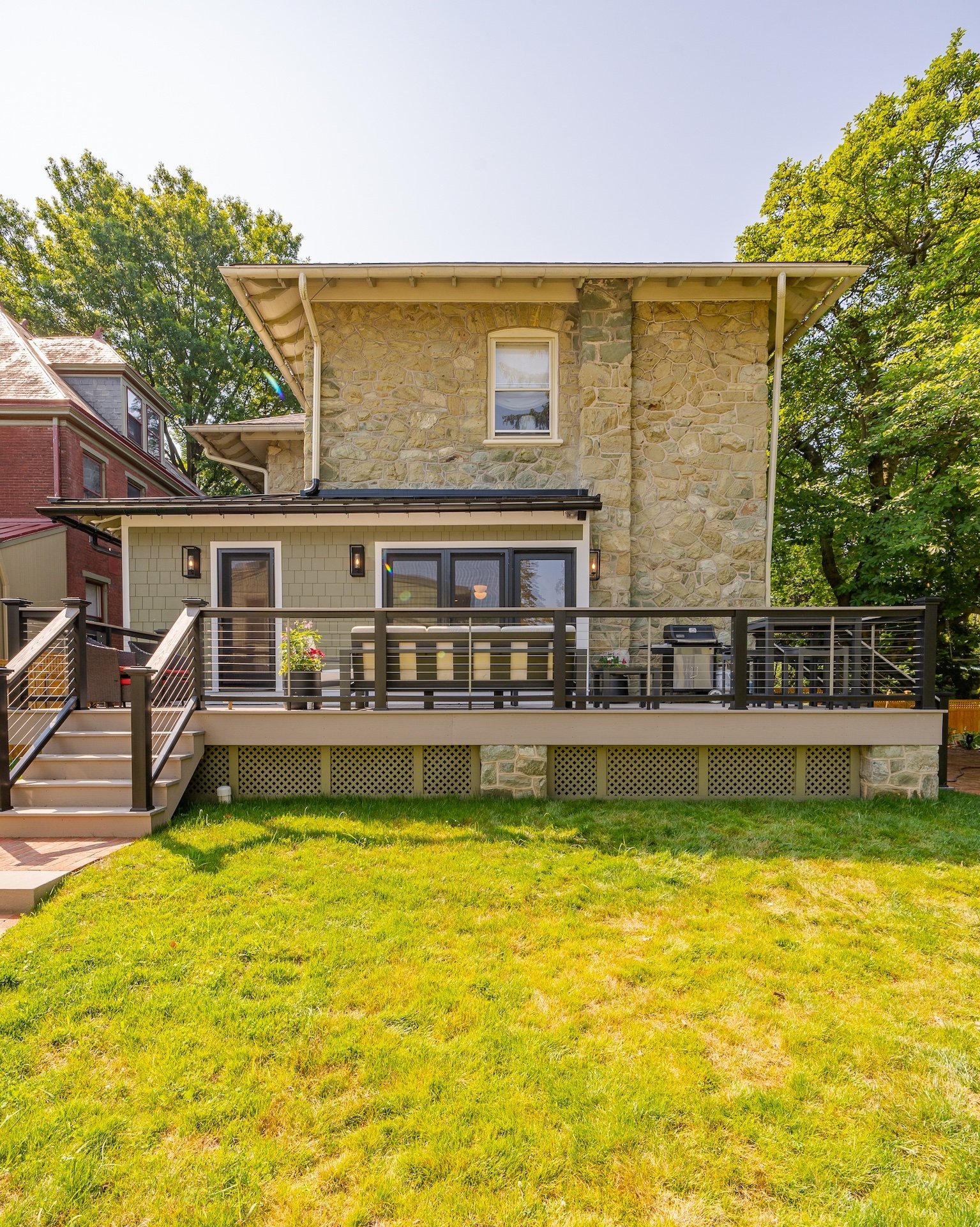 2025 Top Trends in Home Addition Design 2 Large add-on deck behind West Chester Borough brick house