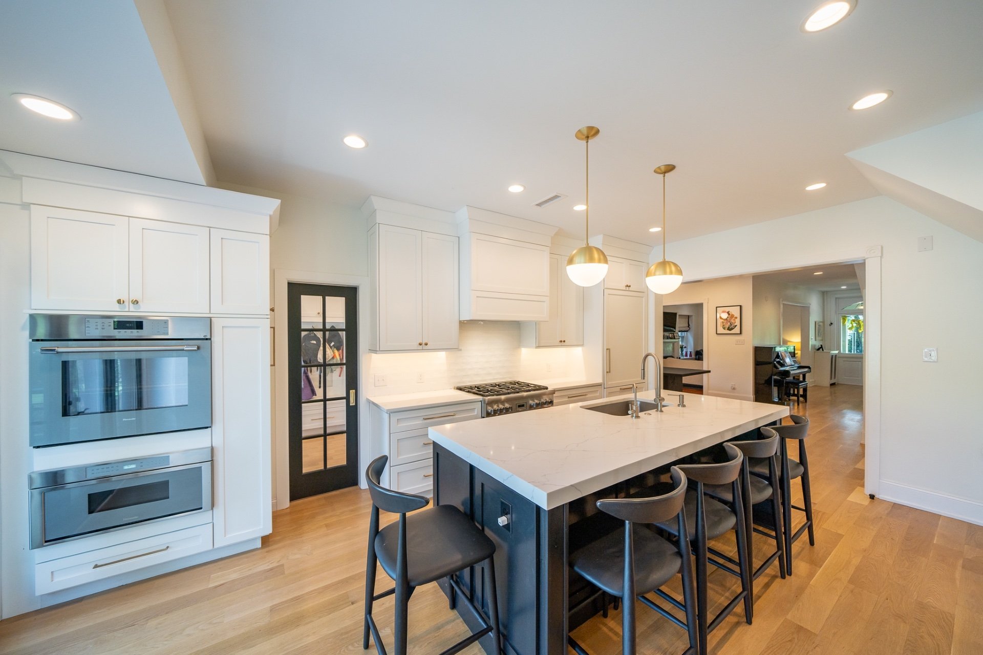 White kitchen with blue and dark gray contrasting finishes