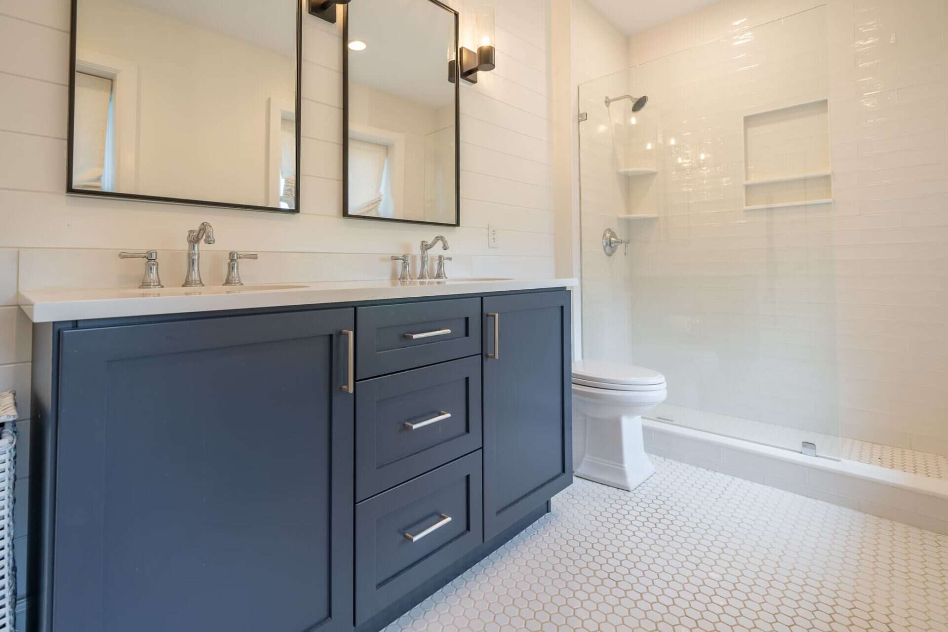 Bathroom with custom wooden cabinets for storage