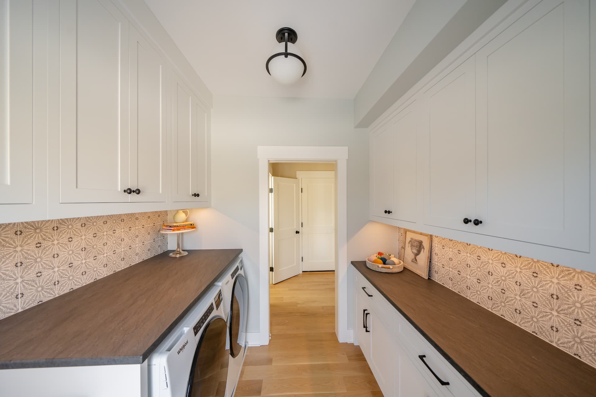 A Laundry Room Fitted With Cabinetries | Laundry Room Lighting
