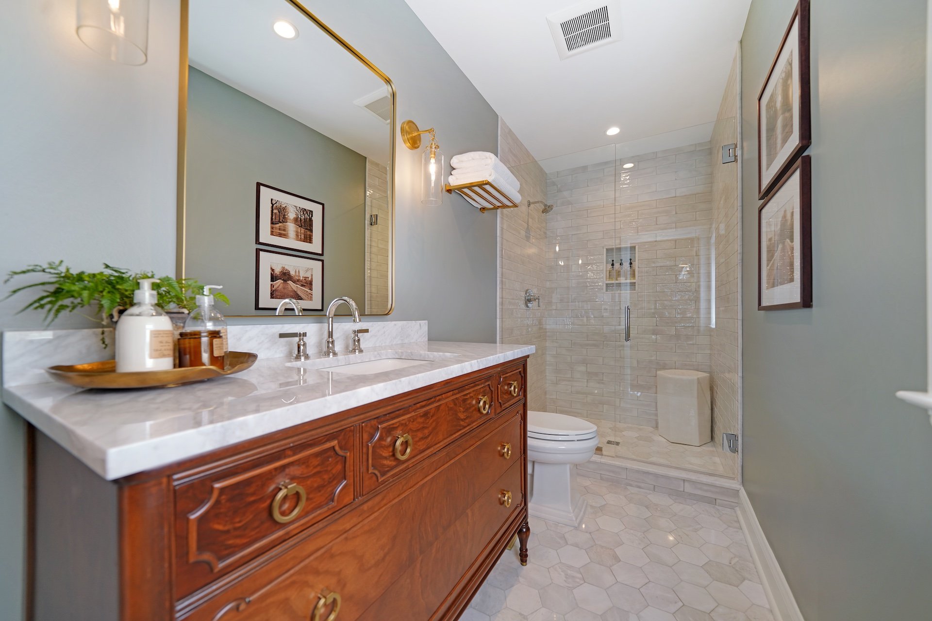 Bathroom with antique style polished wood vanity