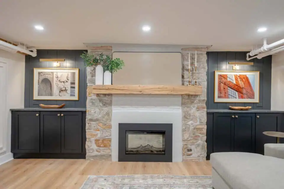 Remodeled West Chester, PA, basement fireplace with stone surround