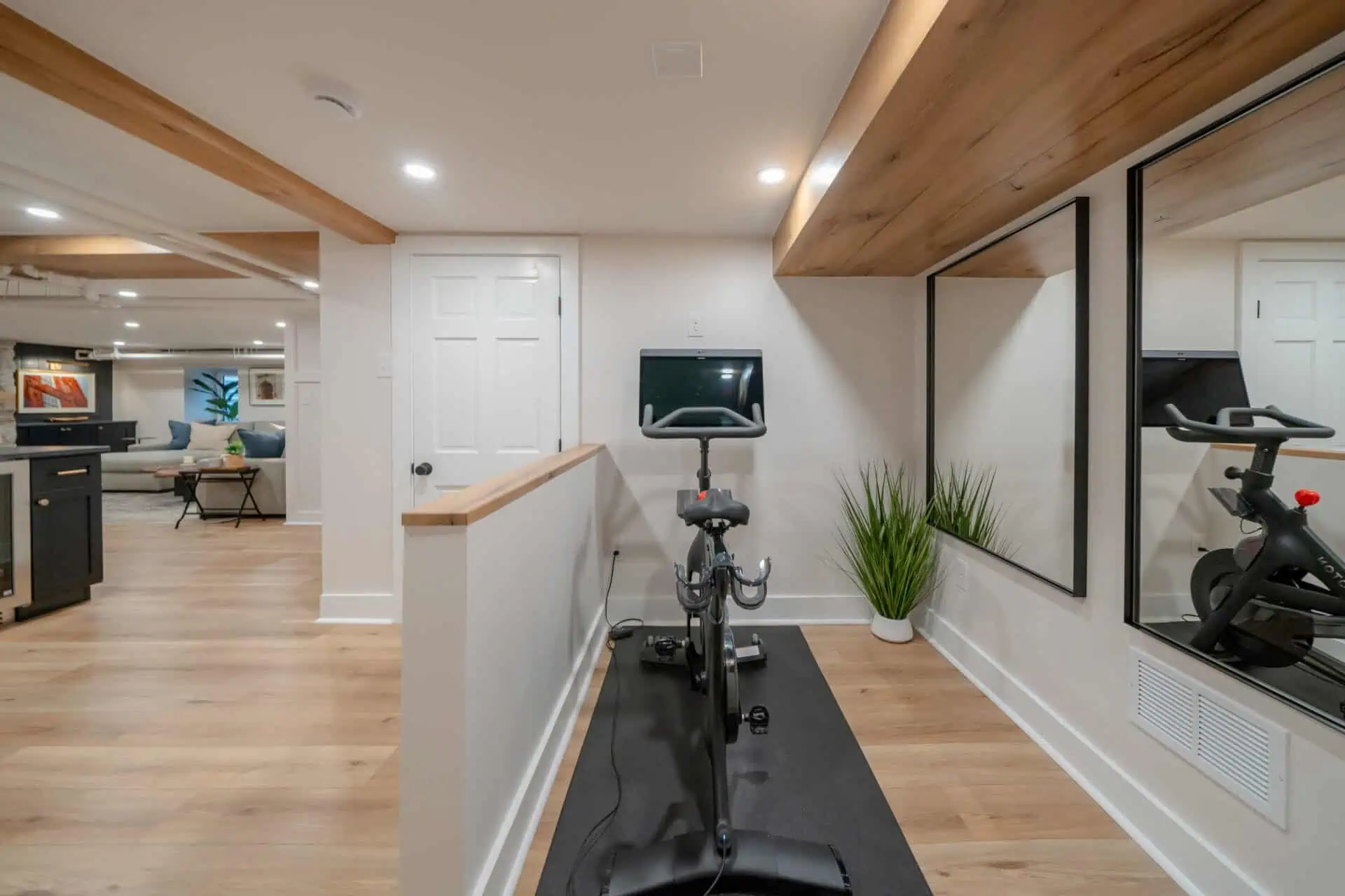 Peloton exercise bike in high-end finished basement