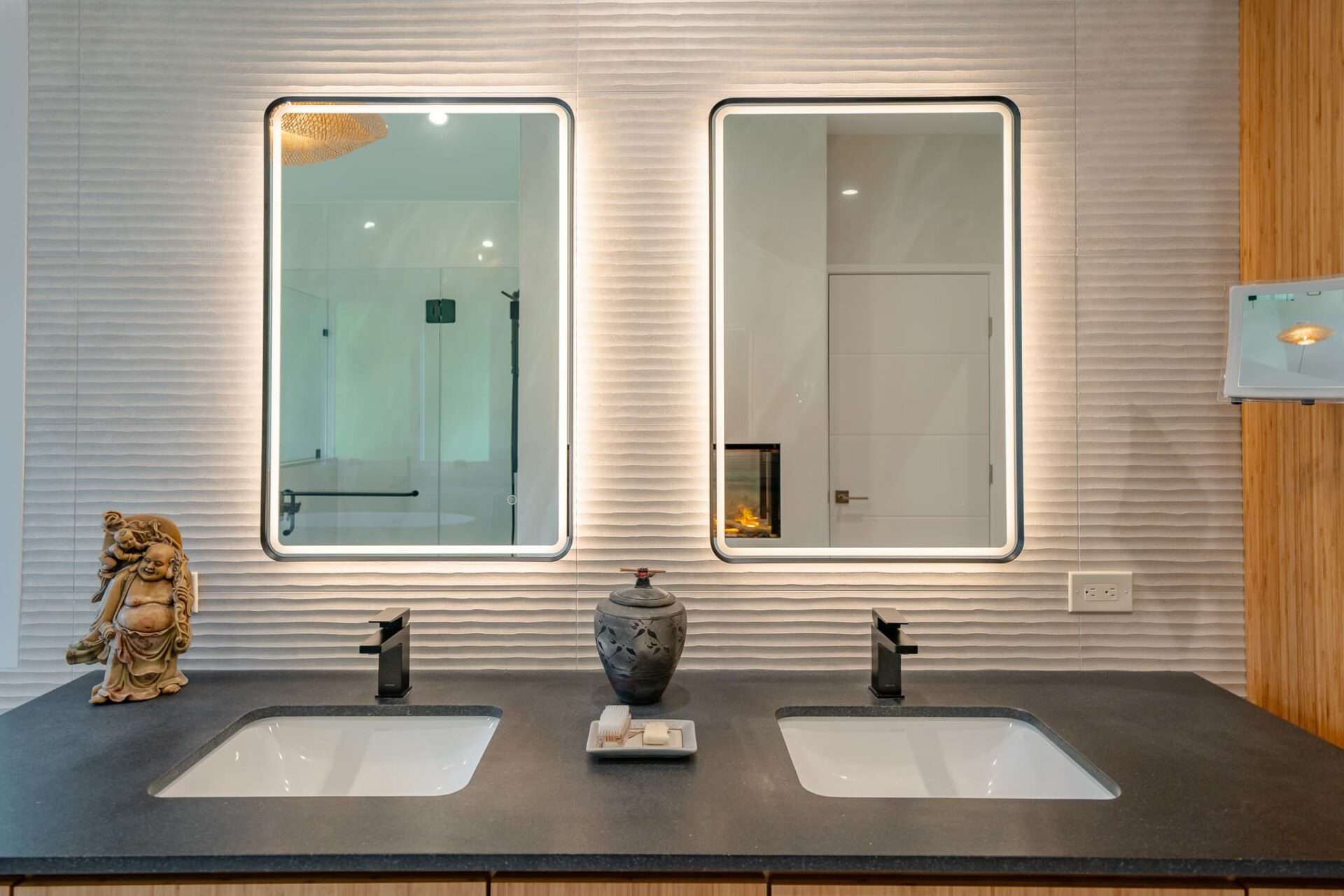 Our Favorite Smart Bathroom Features 2 A smart bathroom with smart double mirrors over a double-sink vanity