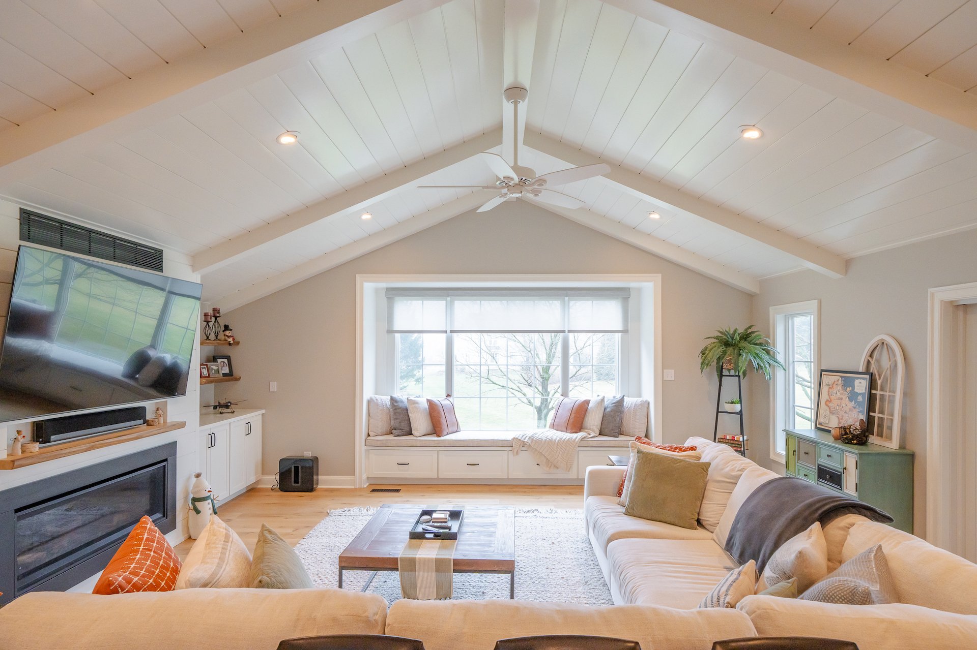Addition project in West Chester PA featuring wood floors and a window seat with beamed ceiling