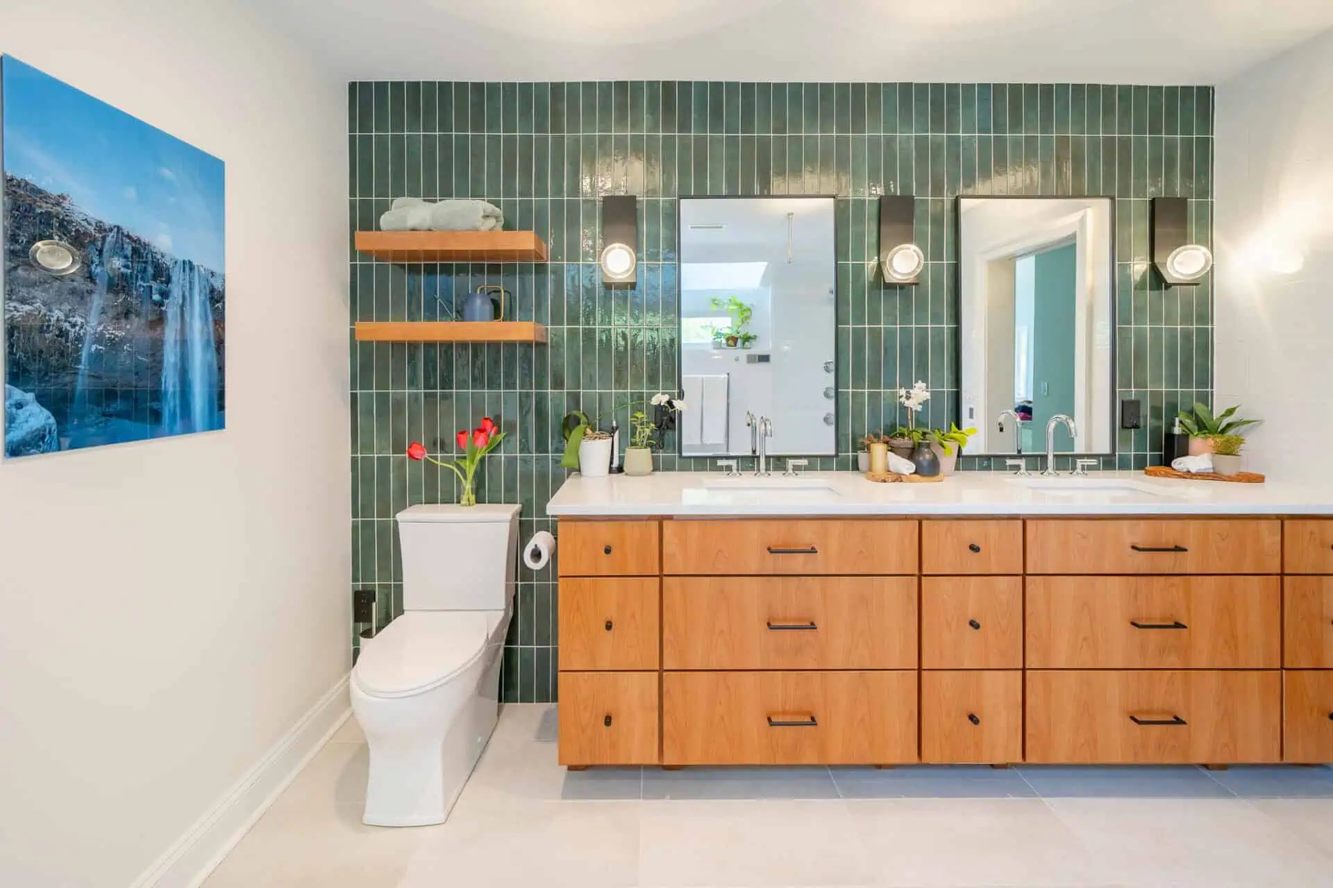 High-end bathroom remodel with an entire back wall of green tile
