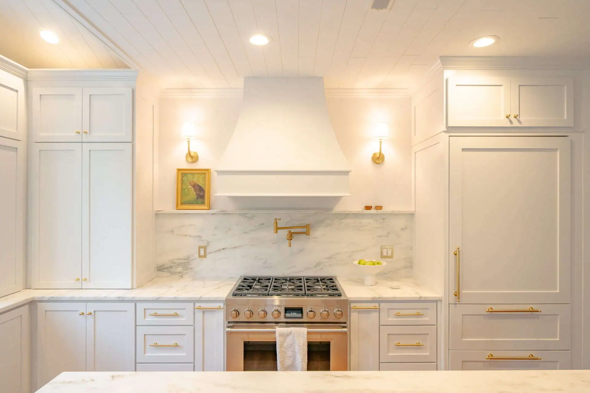 A Vent Hood Over A Gas Burner In A Kitchen - Upscale Kitchen Appliances