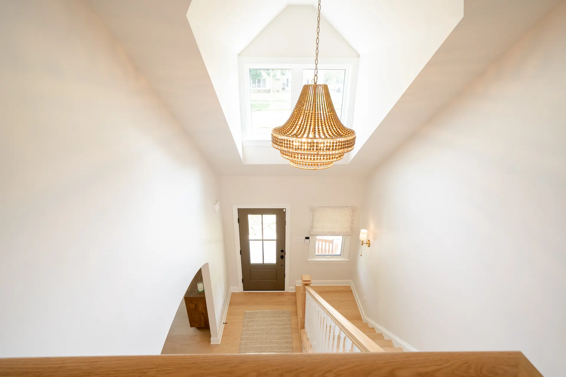 View down the stairwell to the front entry, part of the second-story addition