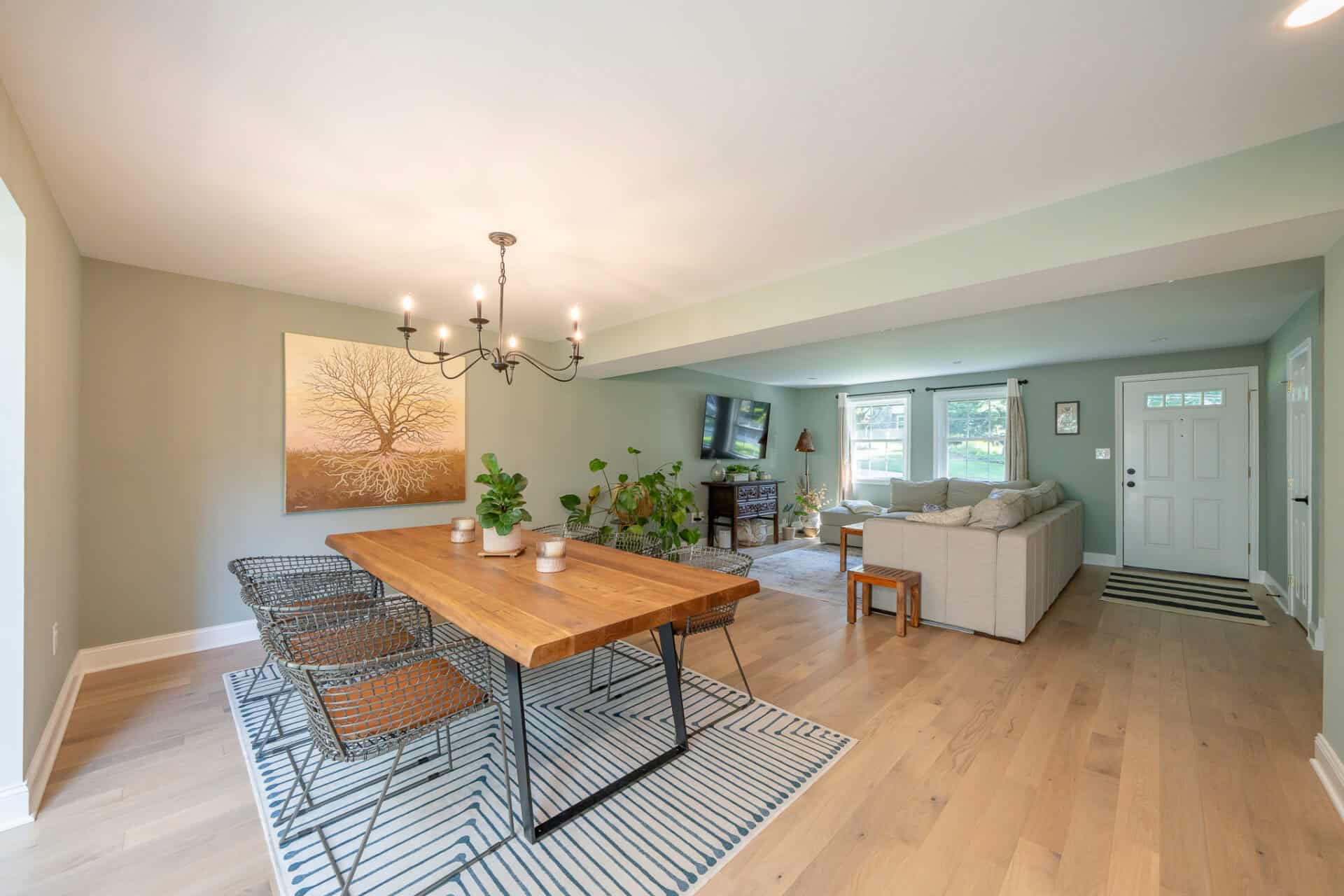 Dining area with contemporary wood table and metal armchairs