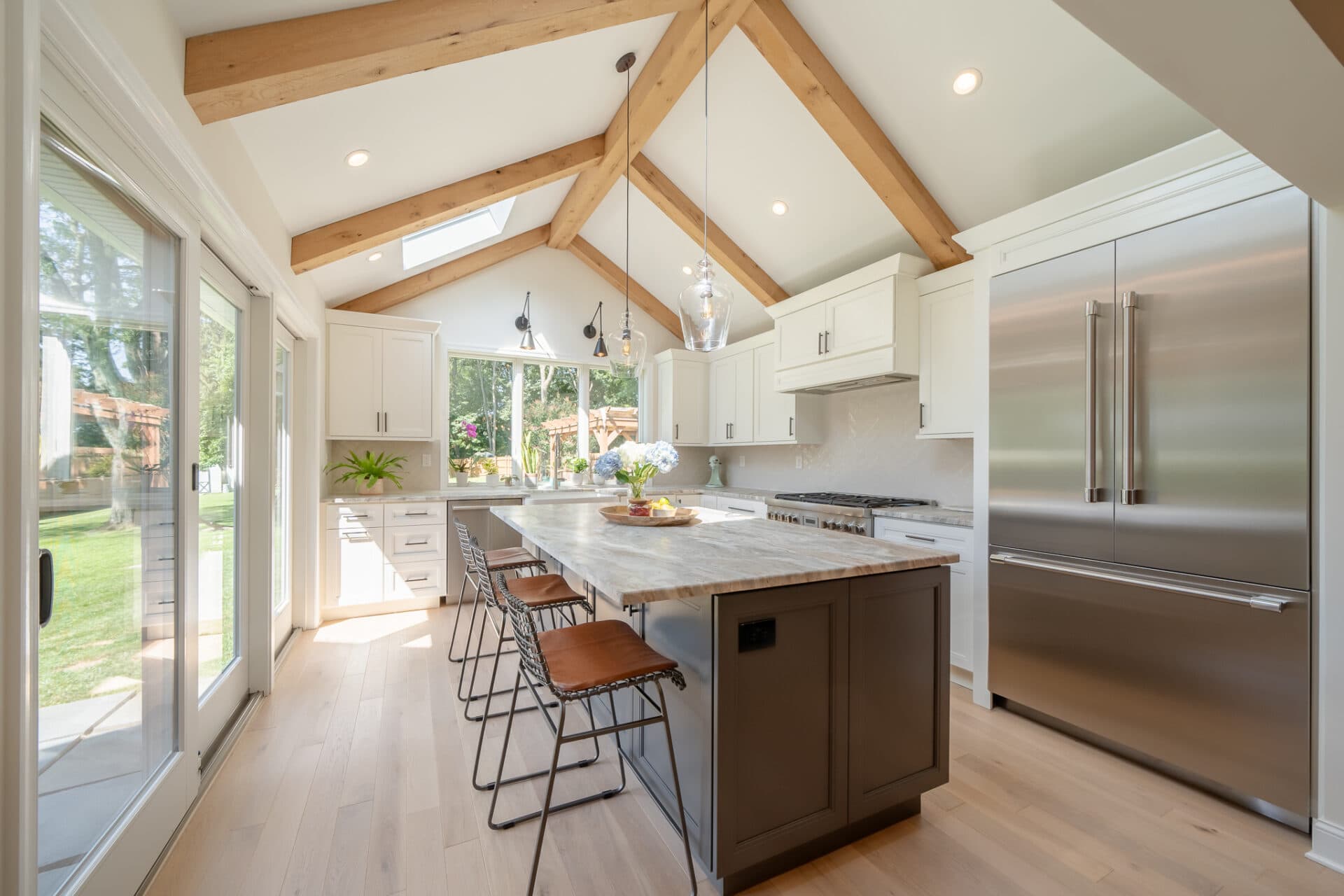 White kitchen with contrasting ceiling beams