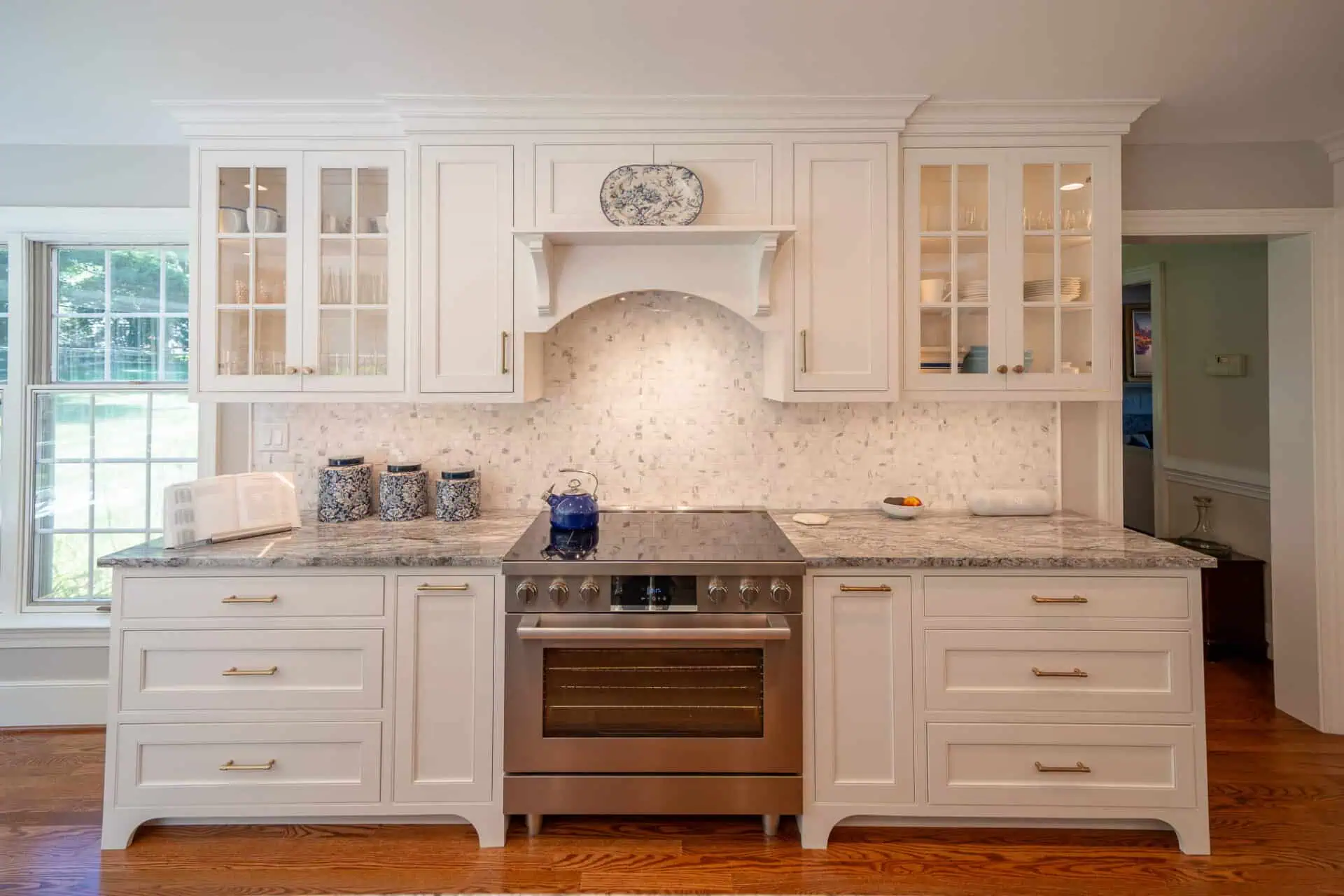 A Gas Burner Built Into A Kitchen Storage Unit With Marble Countertop