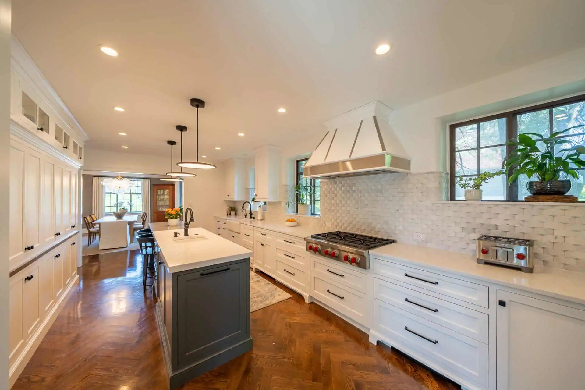 10 Kitchen Backsplash Tile Rules and When to Break Them 2 Kitchen backsplash tiles stretch the full length of the extended countertop and extend up to the height of the bottom of the range hood. https://www.hazleybuilders.com/project/west-chester-whole-home-renovation/