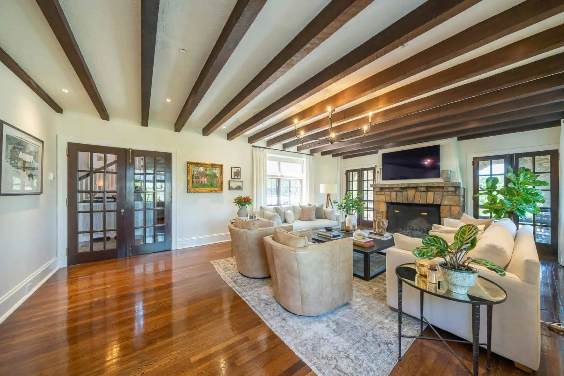 How to Find the Best Builder for Renovations 1 Remodeled Tudor living room with exposed ceiling beams