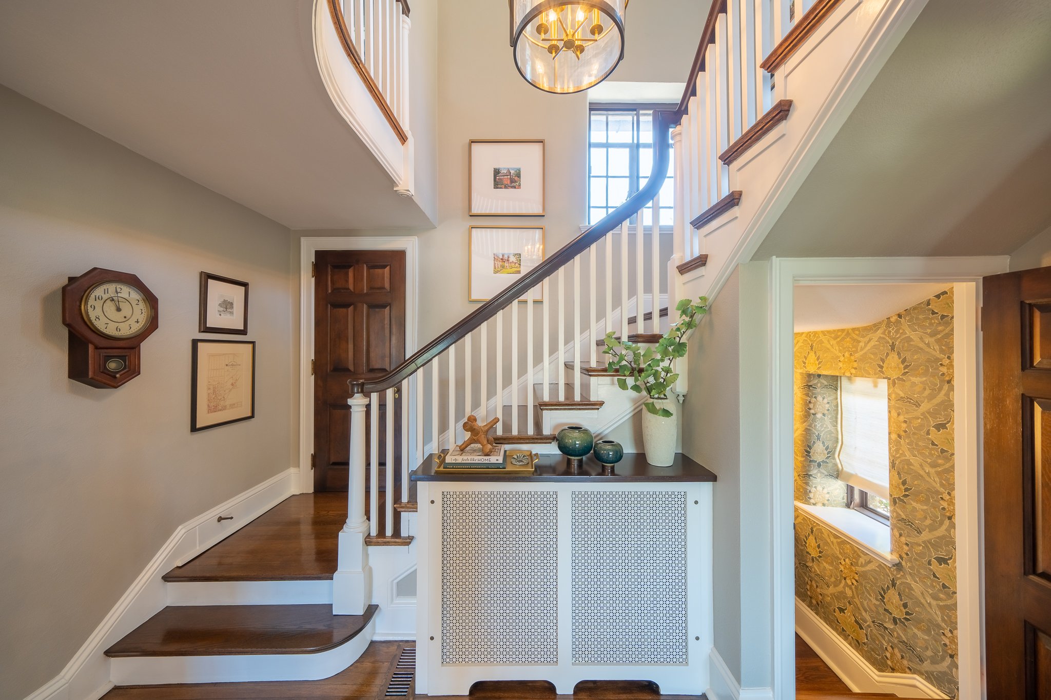Sweeping staircase in Tudor home - 2024 remodeling trends