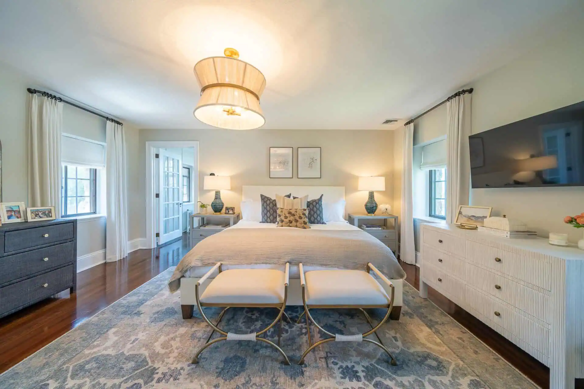 Primary bedroom in restored Tudor home