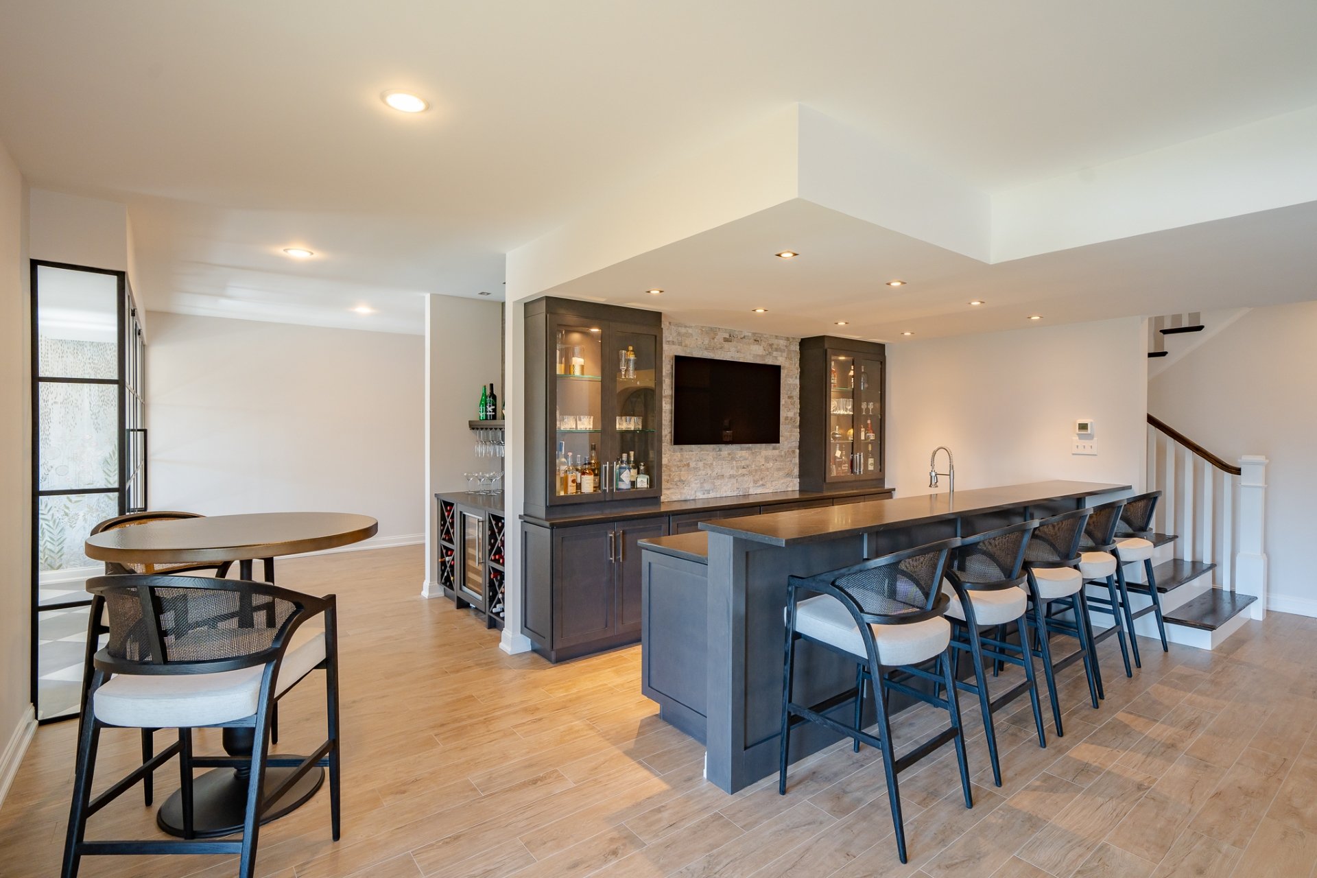 2025 Top Trends in Home Addition Design 3 Home bar area with grey bar