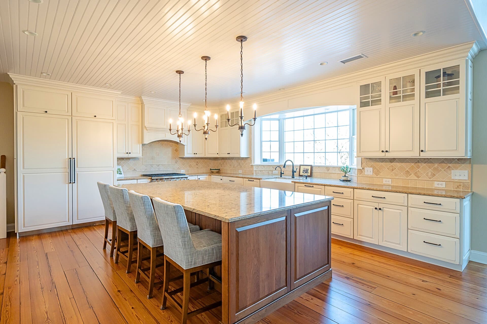 Pendant lightening fixtures overlooking a marble countertop in a kitchen: Kitchen Remodel Checklist