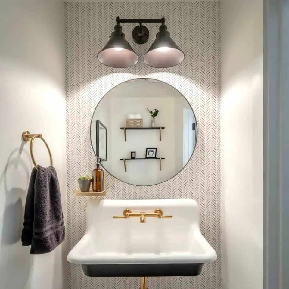 Bathroom with classic cast iron sink with brass fixtures and metal down-lights