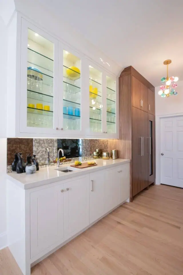 White kitchen with glass front cabinets