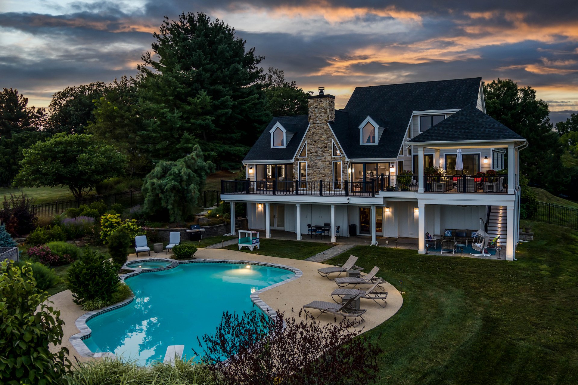 Exterior of custom brick home with in-ground pool in the West Chester, PA, area