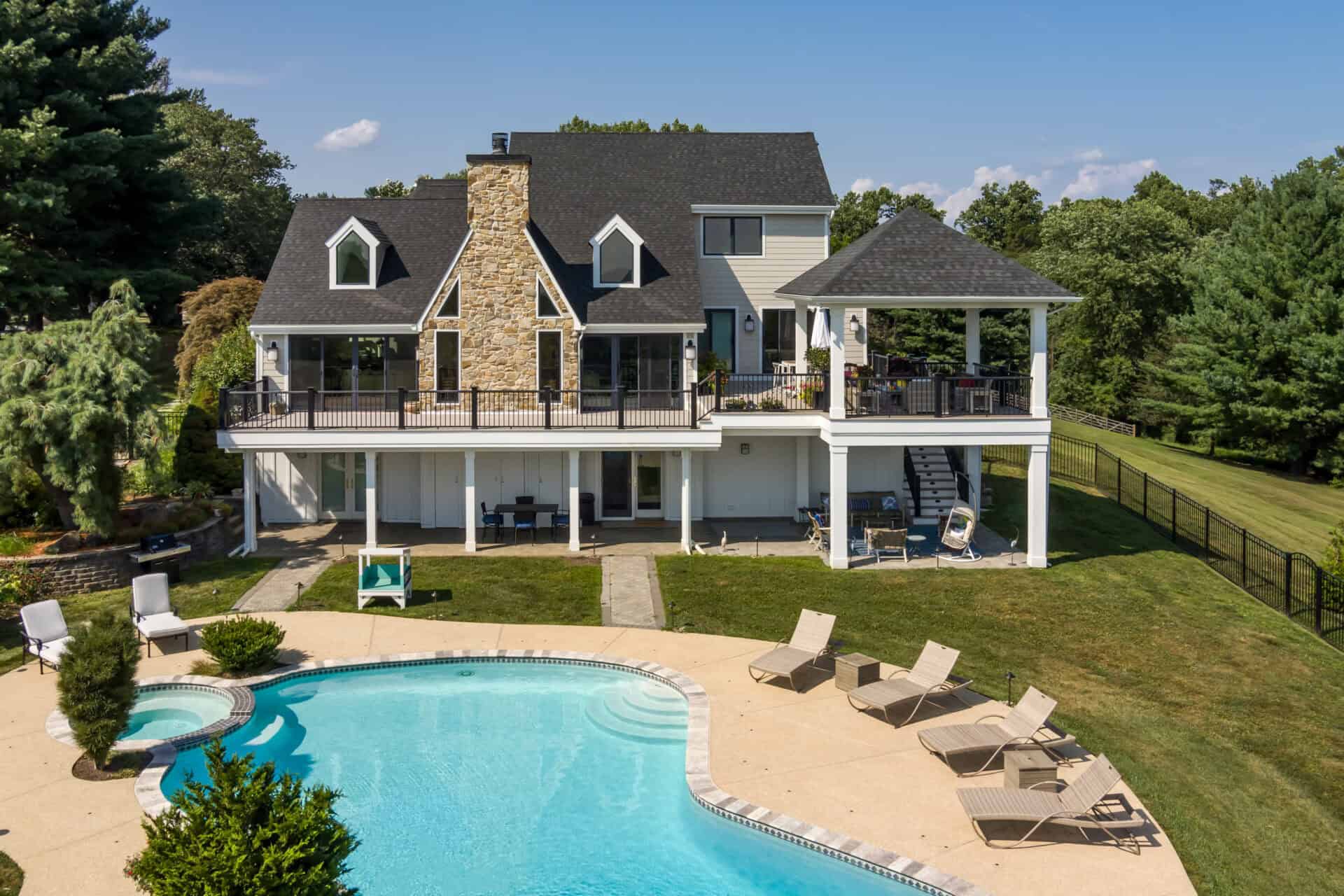 Home Remodeling Plans: How to Get Started on a Successful Project 4 Back of home with wraparound deck and kidney-shaped pool