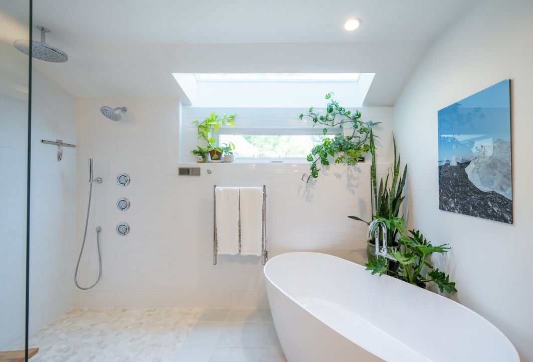 Heated Towel Rack Installed Near A Bath Tub In A Bathroom - Small Master Bathroom Designs
