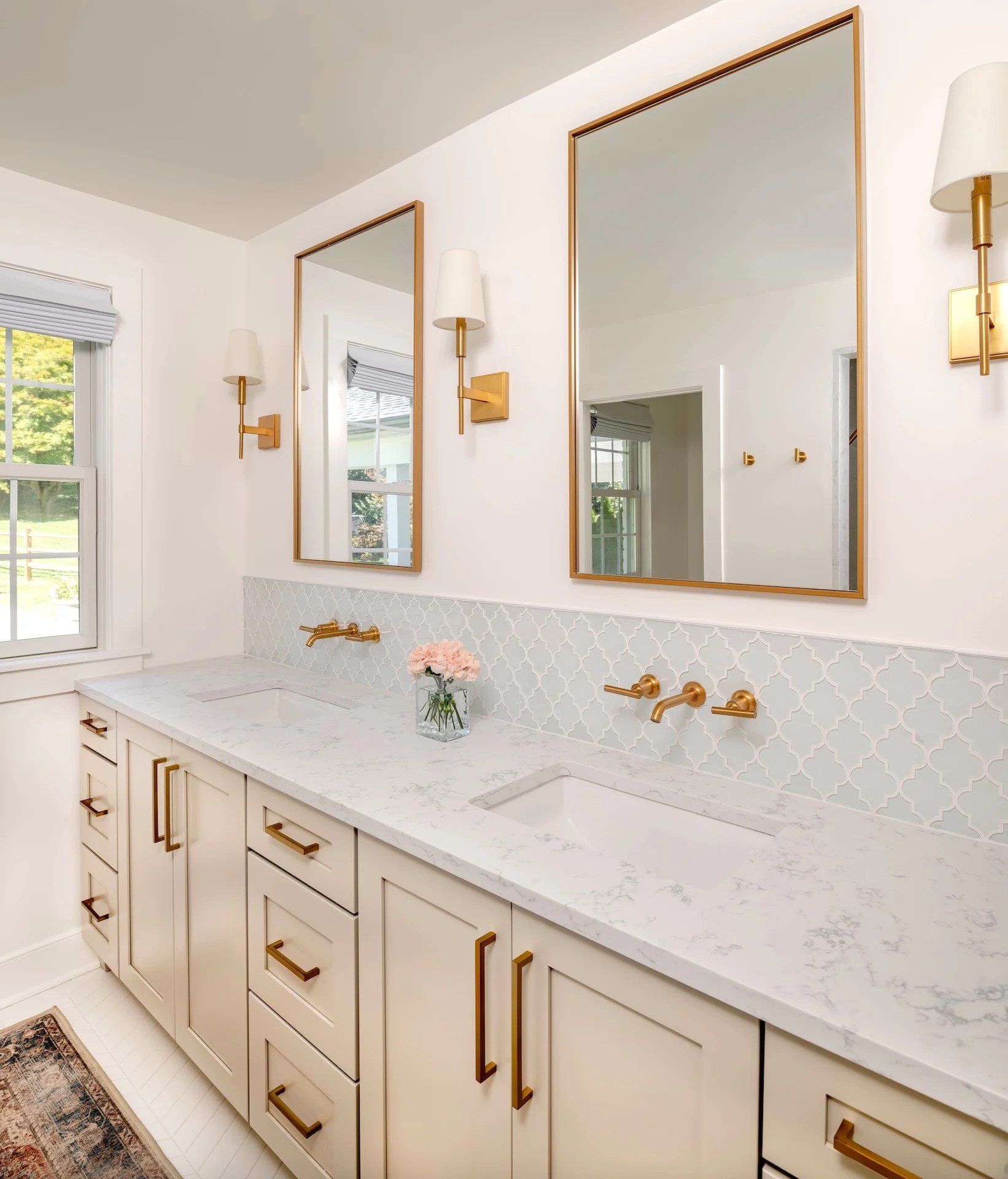 Leveling Up Your Bathroom Remodel with a Modern Bathroom Vanity 5 Bathroom double sink with two large mirrors mounted above an end-to-end marble countertop